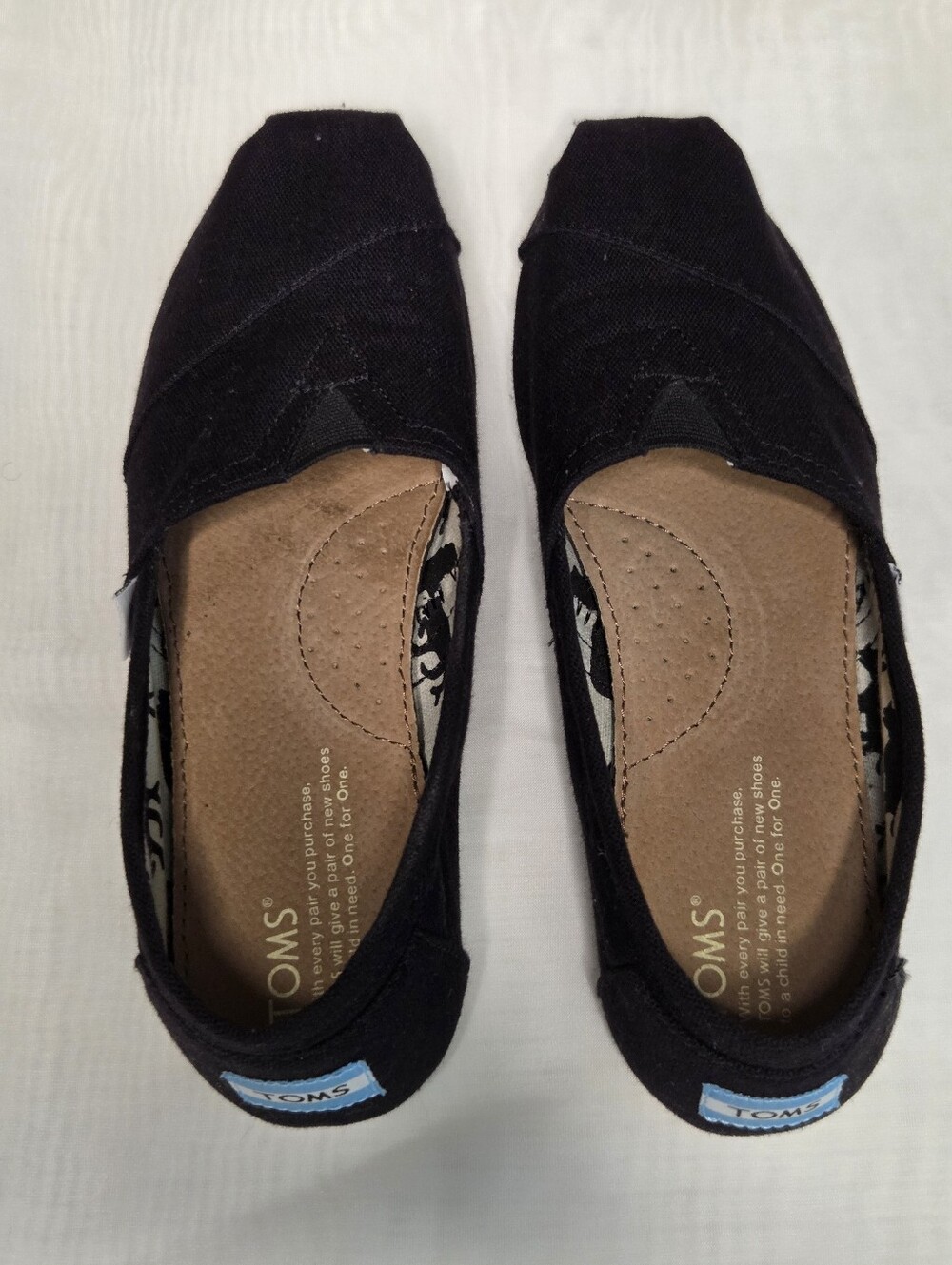 TOMS Black Canvas Slip-On Shoes - Picture 2 of 4